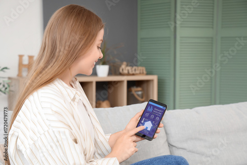 Young woman using mobile ph...
