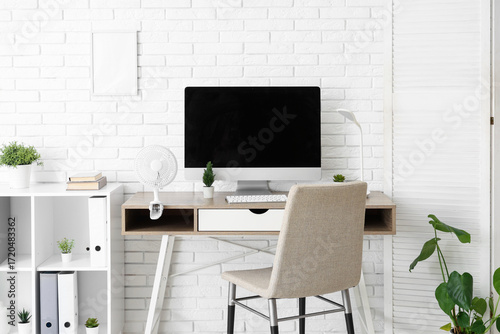 Modern electric fan on tabl...