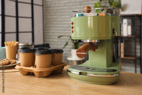 Coffee machine with cups on...