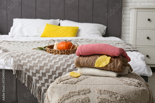 Folded sweaters with autumn...