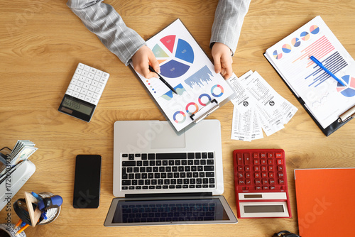 Hands of female accountant ...