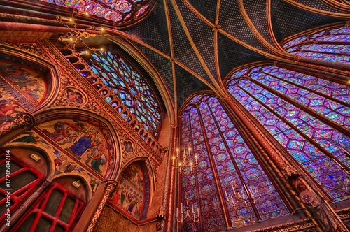 Bild auf Leinwand Wonderful stained glass windows inside the Sacred Chapel next to Notre Dame Cathedral on the Ile de la Cite, Paris, France