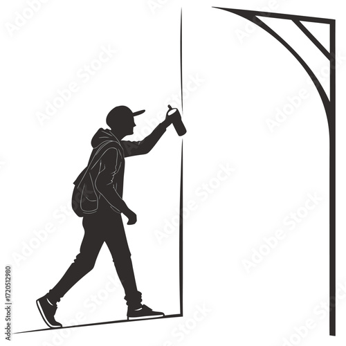 Street artist painting wall silhouette