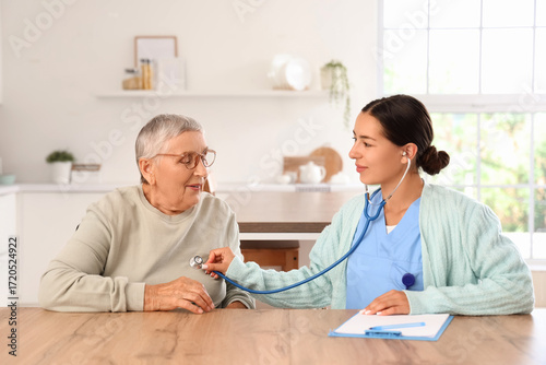 Female caregiver hearing ha...