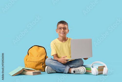 Little boy in eyeglasses wi...