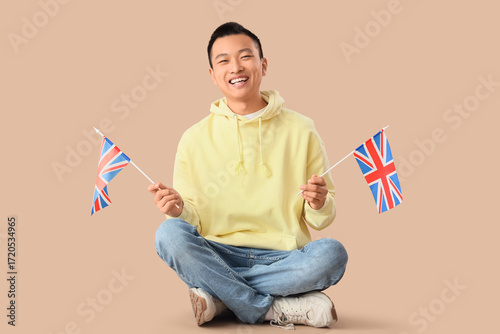 Young Asian man with UK fla...