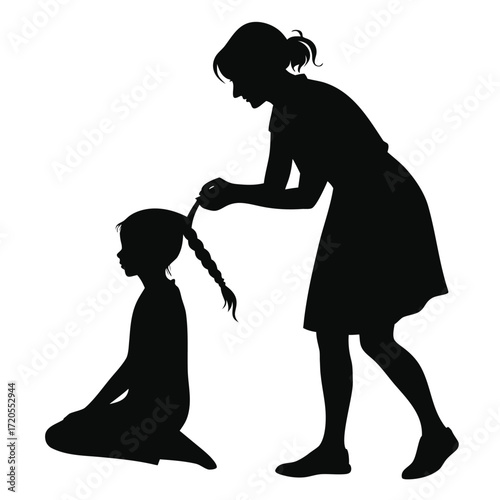 Mother braiding daughter’s hair silhouette