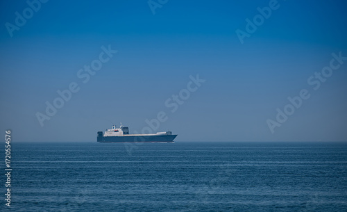 a large cargo ship that sails on the open seas.
