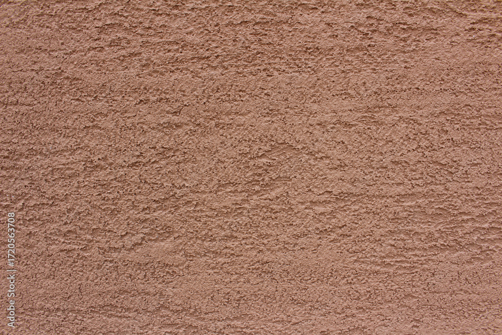 Fototapeta premium Rough surface of brown concrete wall background. Uneven cement wall texture.