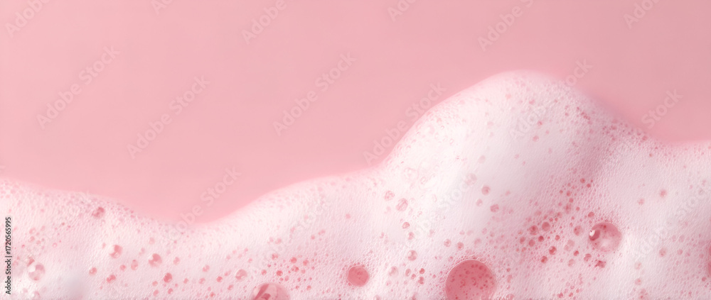 Fototapeta premium A close-up view of pink foam against a pastel background, perfect for beverage themes.