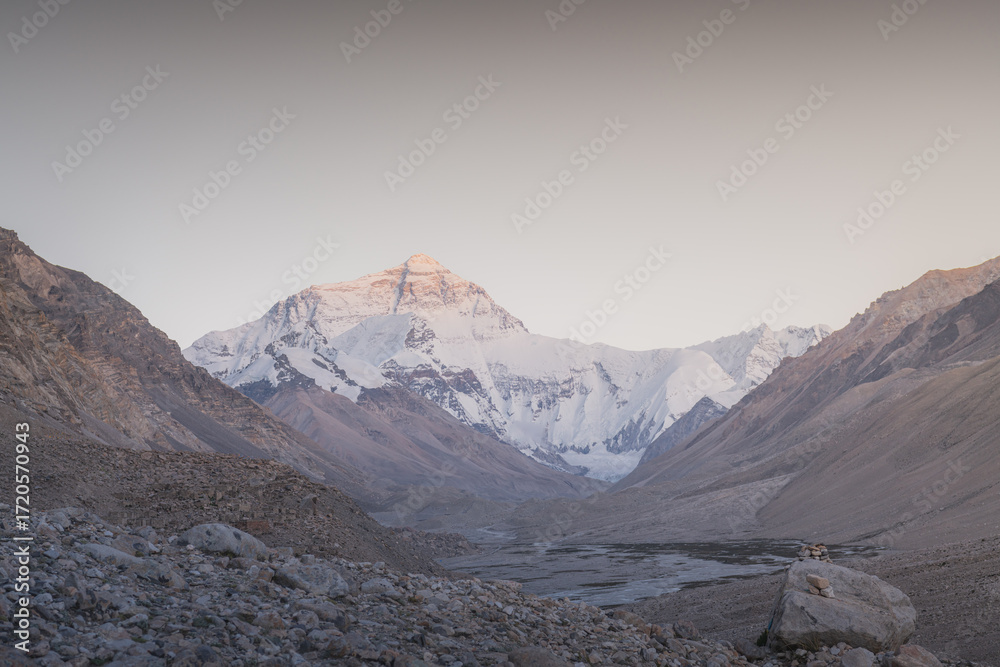Fototapeta premium Mount Everest as seen from Base Camp in Tibet. Tallest mountain on earth, mountaineering destination. Adventure, trekking, tourism. Border between Tibet and Nepal. Panoramic View with Clear Blue Skies