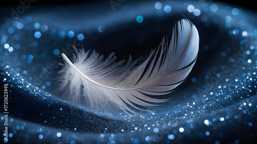 A white feather rests gently on a dark blue surface with sparkling lights