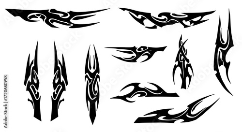 A collection of black tribal tattoo style vector shapes. Isolated abstract graphic elements with sharp points and curves for vehicle decals or fantasy art.