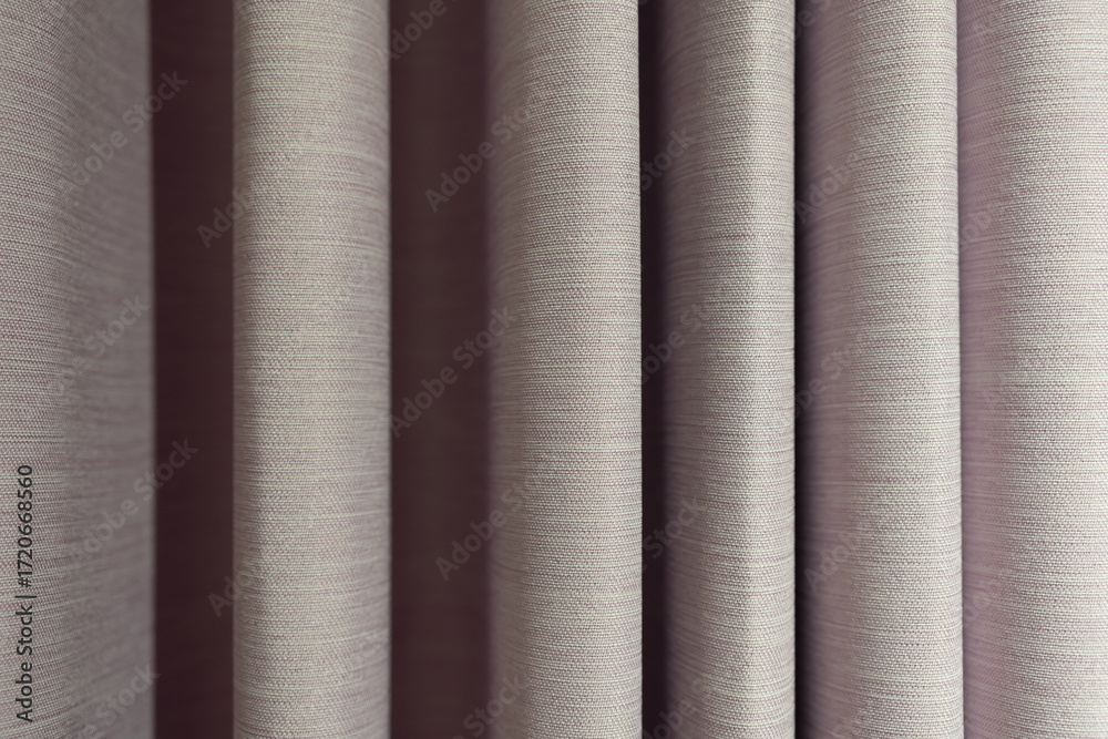 Fototapeta premium Modern Gray Curtain with Pleats. hanging in soft, elegant vertical pleats. a sophisticated and modern feel. The gentle lighting highlights the graceful folds and shadows, creating a sense of depth.