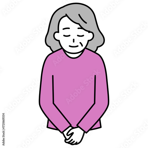 お辞儀をする年配の女性