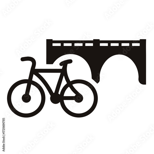 Monochromatic image depicts a bicycle near a classic bridge archway structure