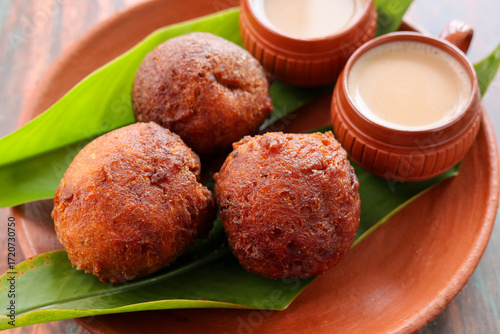 Indian snack Kerala food bonda made from wheat flour  and milk tea undampori 