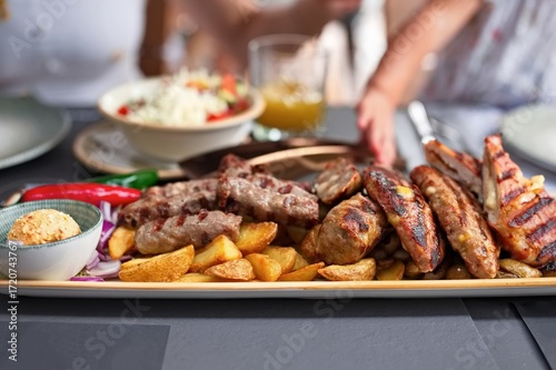 Closeup of traditional minced meat dish with vegetables on the table