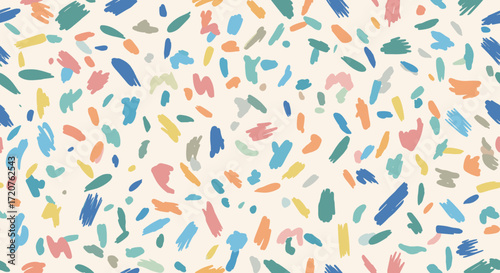 A playful and colorful abstract pattern with scattered brushstrokes and confetti-like shapes across a light cream background. This vibrant design evokes a sense of joy and artistic expression.