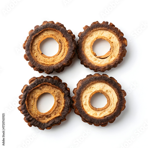 Dried bitter gourd rings, crisp and dehydrated, isolated on a white background, used in cooking, snacks,