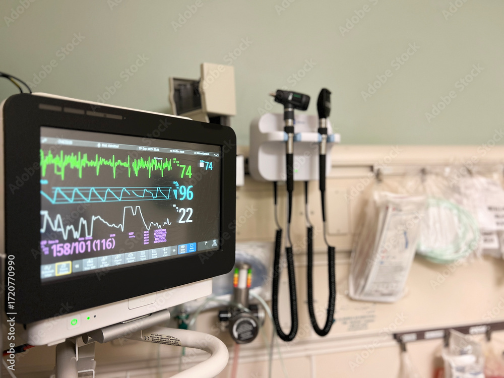 Naklejka premium Blood pressure monitor, medical monitoring equipment in a hospital room representing health care, emergency departments and medicine. 