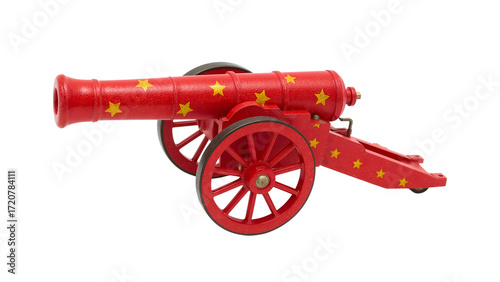 Red decorative cannon with yellow stars and wooden wheels isolated on white, vintage toy or prop for celebrations and festive events