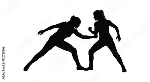 Dynamic silhouette of two women engaged in intense combat training or sports action isolated on white background