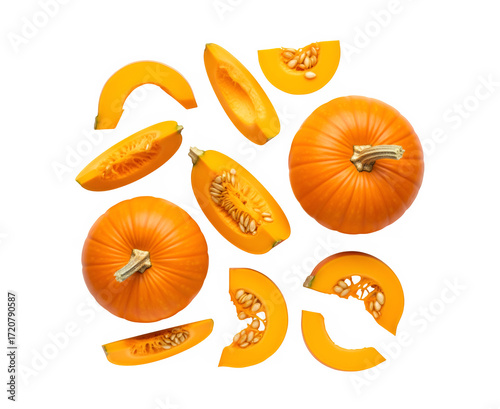 Collection of whole and sliced pumpkins fresh out of the patch, isolated on a white backdrop. Overhead view

