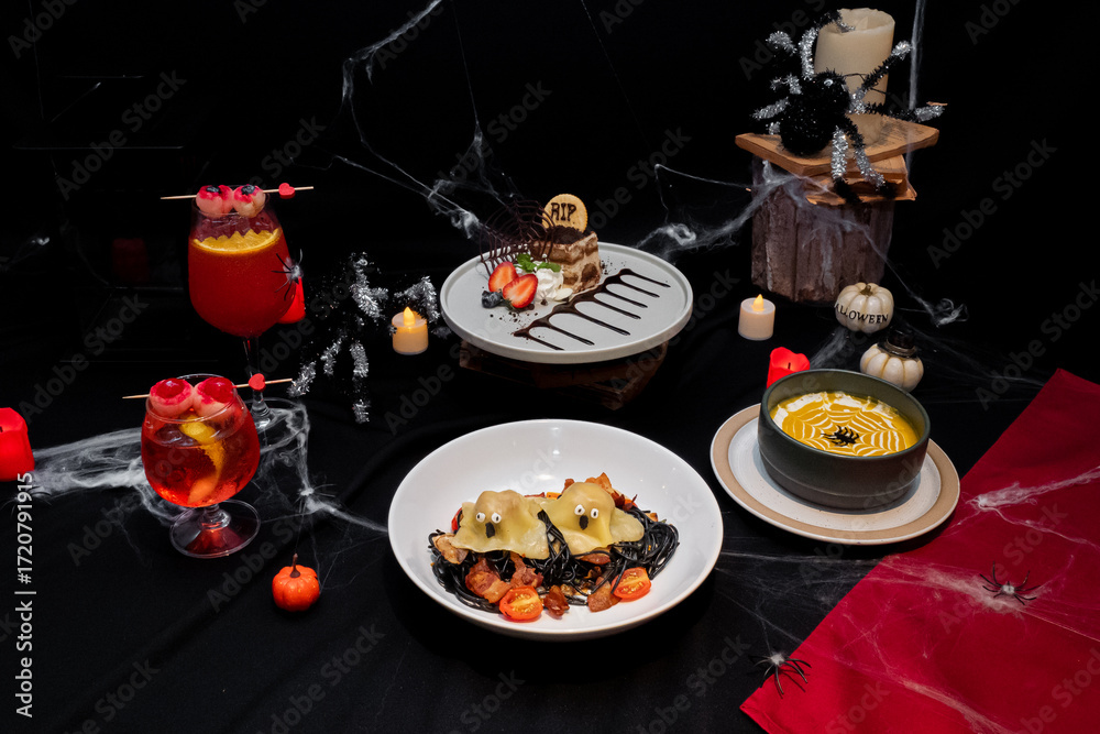 Festive Halloween Feast: A spread of spooky culinary creations with festive decorations. featuring an eye-catching arrangement of thematic delicacies