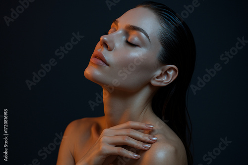 beauty portrait of elegant woman with flawless skin and dramatic lighting