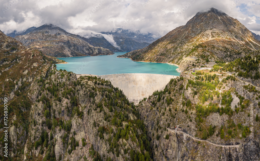 Obraz premium Aerial panoramic view of Emosson Dam and Lake in the Swiss Alps, renewable hydropower reservoir and mountain landscape, sustainable clean energy infrastructure