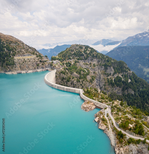 Aerial panoramic view of Emosson Dam and Lake in the Swiss Alps, renewable hydropower reservoir and mountain landscape, sustainable clean energy infrastructure