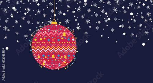 A festive red bauble with a knitted pattern hangs amidst falling snow and snowflakes against a dark blue background.