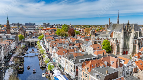 Schilderij op canvas Leiden town aerial drone view from above, typical Dutch city skyline with canals