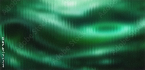 Emerald green abstract background with blurred vertical lines offers a modern, organic texture for wallpapers, textiles, and creative graphic design projects