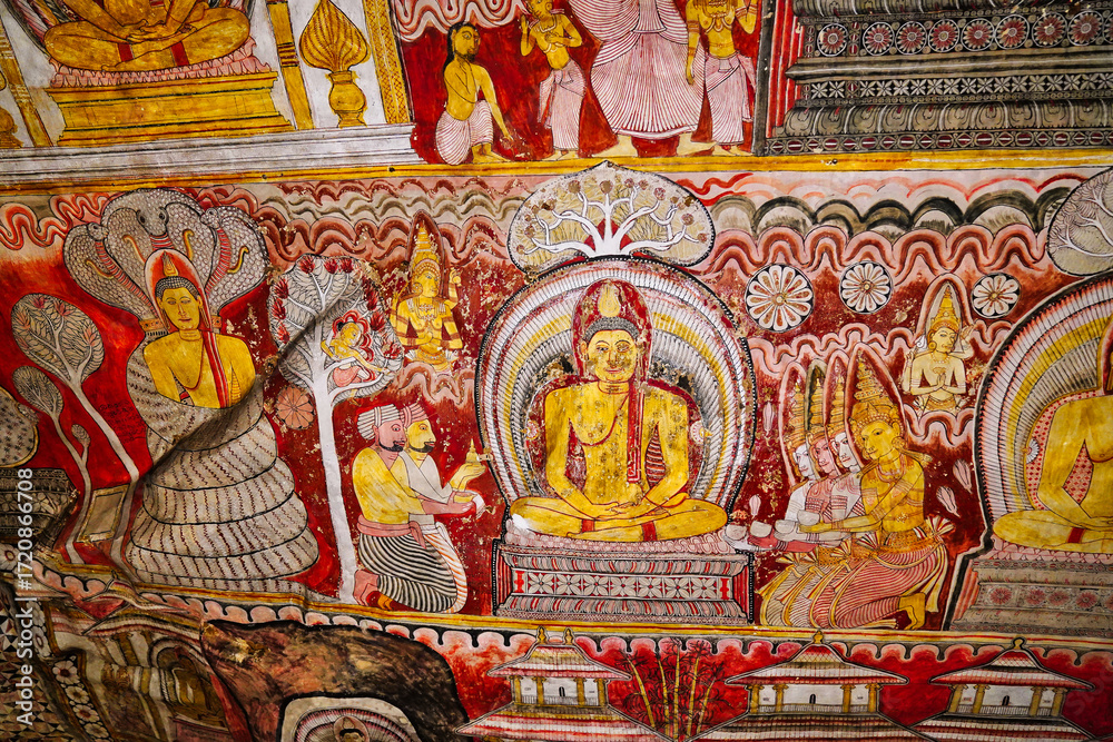 Fototapeta premium Mural of Buddha under Sacred Fig tree with devotees and celestial beings in the Cave of Kings, Dambulla Cave temples built 1st centure BCE by King Valagamba and Lankan kings in Dambulla,Sri Lanka