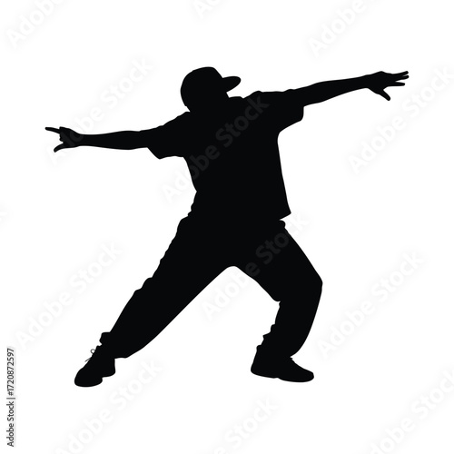 Silhouette of a dancer in motion with arms extended