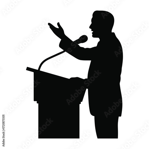 Silhouette of a man speaking at a podium with a microphone