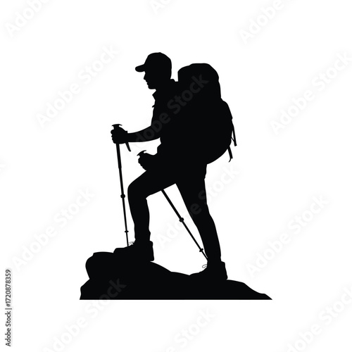 Silhouette of a hiker with backpack and trekking poles on rocky terrain