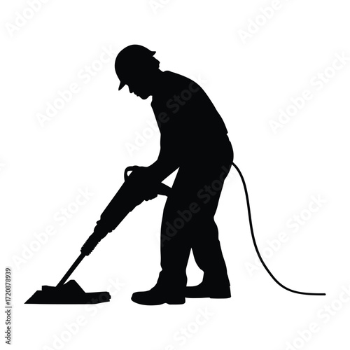 Silhouette of a construction worker operating a jackhammer