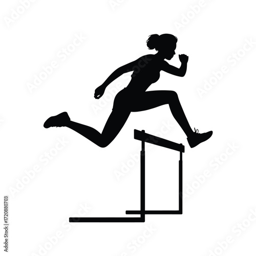 Silhouette of a female athlete jumping over a hurdle during a race
