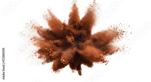 An energetic burst of fine brown powder, like cosmetic blush or cocoa, exploding mid-air with sandy particles suspended against an isolated white background