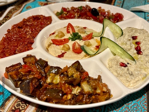 Mezze platter appetizer plate with hummus, baba ganoush, motabal, eggplant