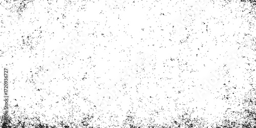 Abstract grunge texture of black ink splat drops on a dirty glass surface with a film