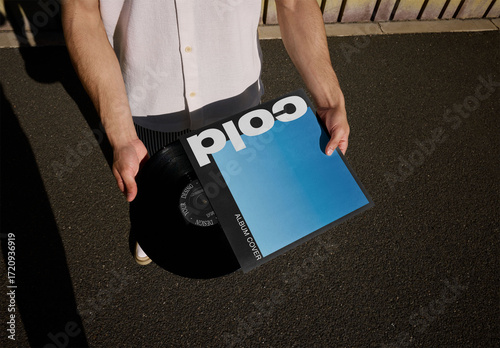 Mockup Of Man Holding Customizable Lp Cover And Record