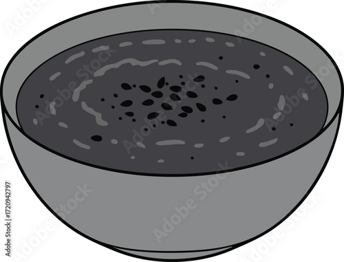 A gray bowl filled with dark, thick soup, possibly a dessert.