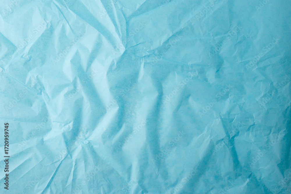 Obraz premium textured crumpled blue paper sheet with natural folds and wrinkles minimal abstract background for scrapbooking branding packaging mockup craft design material or digital presentation layout use