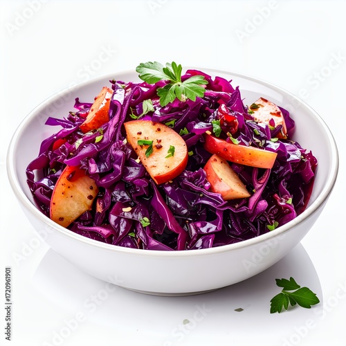Vibrant red cabbage and apple salad in a white bowl against a clean, bright background