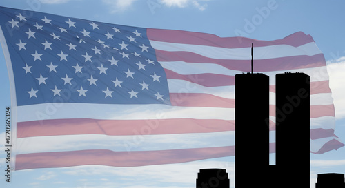 An American flag flying with a silhouette of the World Trade Center in the background. This image evokes the memory of a pivotal moment in history