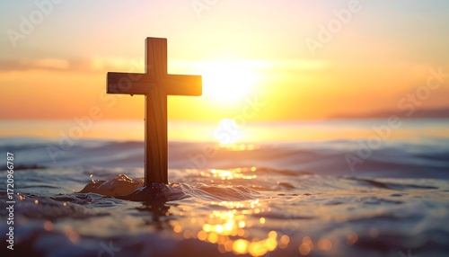 Wooden cross in sunset ocean waves
